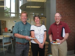 Three faculty possing for a picture